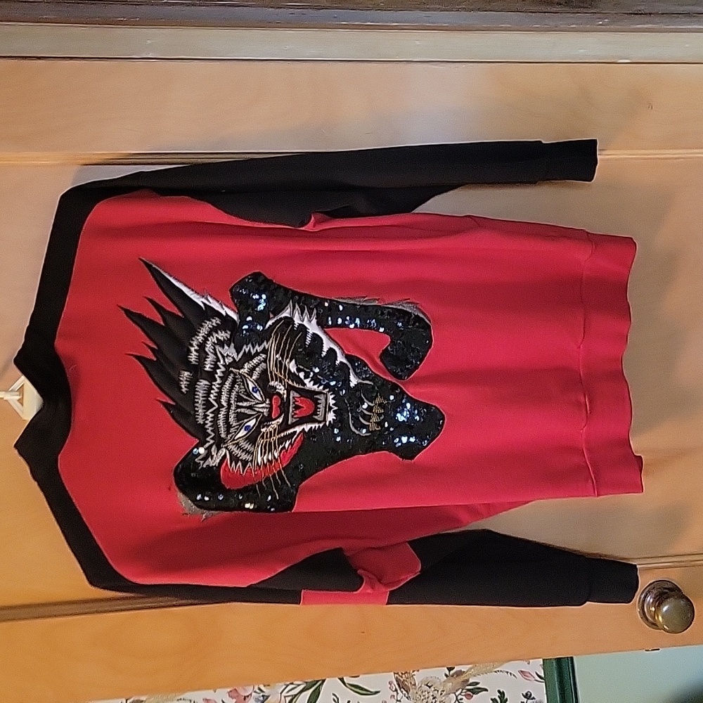 Fabulous vintage sequined tiger in black, gold and white on a red cotton jacket.
